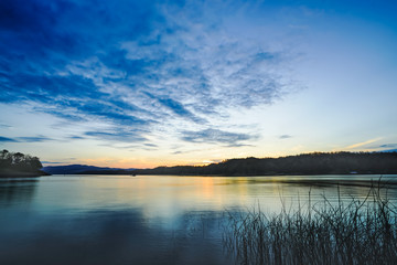 Fototapeta premium Wide-angle lake in the morning, sunrise after the mountain