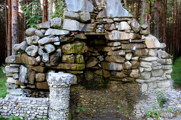 Beautiful fountain of stones in the forest