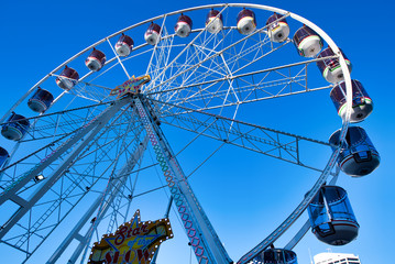 SYDNEY - AUGUST 18, 2018: Ferris Wheel in Darling Harbor on a beautiful day. Sydney attracts 20 million tourists annually