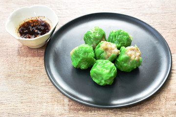 steamed Chinese jade dumpling filling minced shrimp or dim sum dipping soy sauce on plate