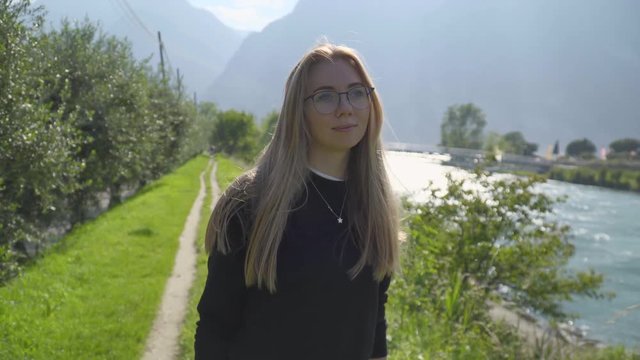Teenage Girl Walking Along hte River