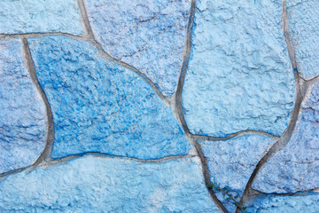 texture of stone multi-colored concrete wall with stains, cracks and patterns