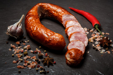 top view sliced circle of dry smoked sausage with garlic and chili