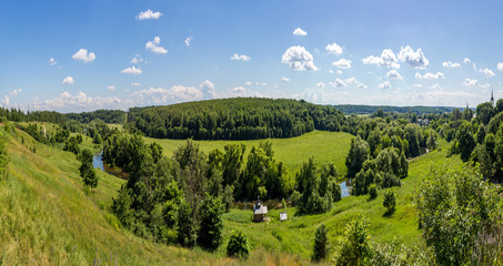 Obraz premium Panoramic view of the green valley of the river Protva from the village Ryabushki, Borovsk city, Kaluzhskiy region, Russia. June 2019