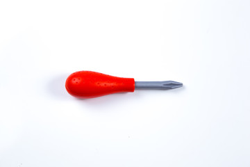 Kids construction toys tools , Toy plastic screw-driver with the red handle on a white background