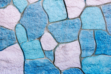 texture of stone multi-colored concrete wall with stains, cracks and patterns