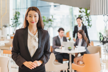 Portrait group of Asian business people in formal suit in working office