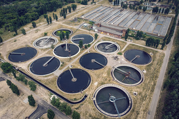 Modern urban wastewater and sewage treatment plant with aeration tanks, industrial water recycling and purification, aerial view