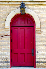 Fototapeta na wymiar Red door with lantern