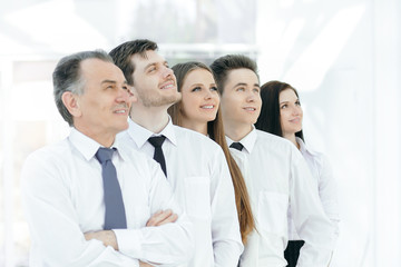 successful business team looking at copy space.