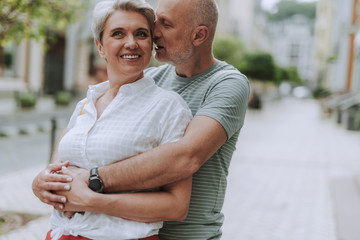 Happy gray-haired couple is spending holiday together