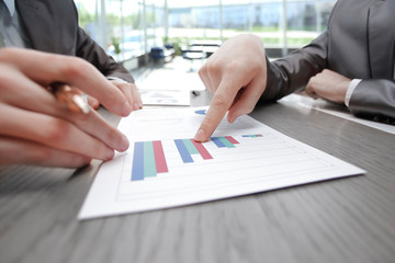 close up.business points the finger at the financial report.