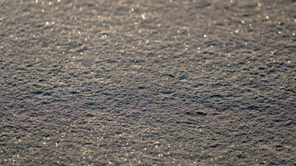 The background sheet is covered with frost on metal