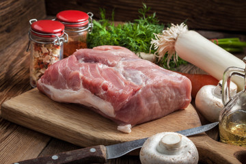 Raw loin on a chopping board.