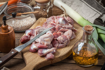 Preparing to cook raw chicken stomach.
