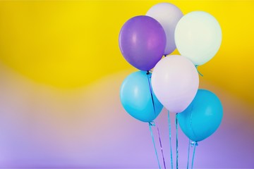 Bunch of colorful balloons on gradient background