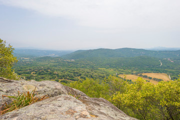 Fototapeta premium Scenic landscape of green hills and rocky mountains of the island of Sardinia in spring