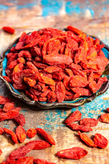 Healthy superfood, red dried goji chinese wolfberry berries, used in many snack foods and supplements, granola bars, yogurt, tea blends, fruit juice as whole berries or ground seeds, seed oil.