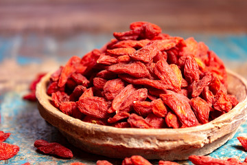 Healthy superfood, red dried goji chinese wolfberry berries, used in many snack foods and supplements, granola bars, yogurt, tea blends, fruit juice as whole berries or ground seeds, seed oil.