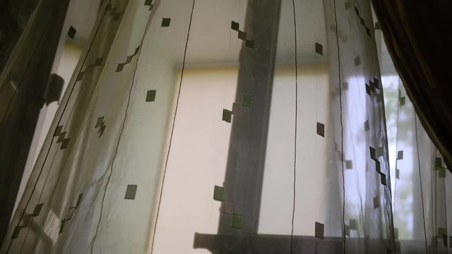 Transparent Window Curtain on a Wind in a morning. Opened Balcony door..