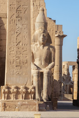 Looking aside the obelisk and the statue of Ramesses II into the Temple of Luxor