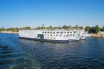 Nile cruise ships docked at the quay, in the vicinity of Luxor