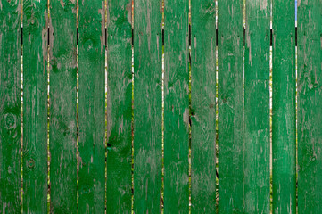 old wooden fence with peeling green paint,backgrounds, textures