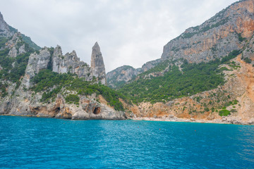 Naklejka premium Rocky coast of the island of Sardinia in the Mediterranean Sea viewed from a boat