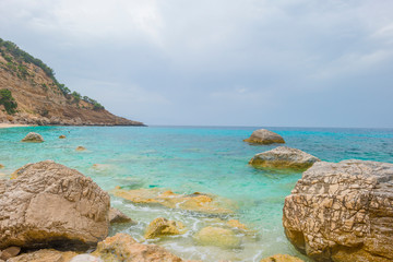 Beaches of the island of Sardinia in the Mediterranean Sea in sunlight in spring