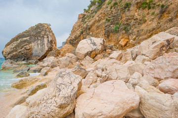 Beaches of the island of Sardinia in the Mediterranean Sea in sunlight in spring