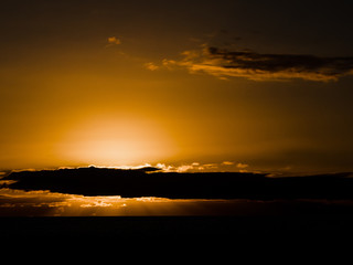 Sunset behind some clouds