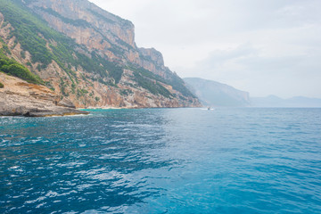 Rocky coast of the island of Sardinia in the Mediterranean Sea viewed from a boat