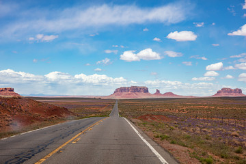 Fototapeta na wymiar Monument Valley highway, Tribal Park in the Arizona-Utah border, USA