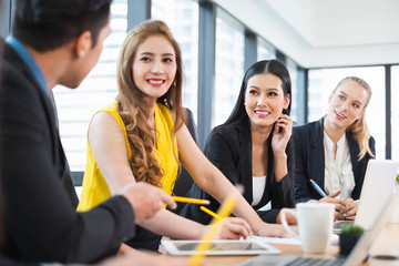 Group of Asian business people working and meeting/discussing at office