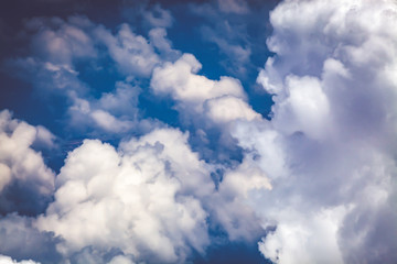 white fluffy clouds on blue sky
