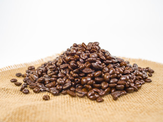 coffee beans in shape of heart on wooden background