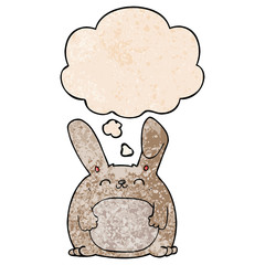 cartoon rabbit and thought bubble in grunge texture pattern style
