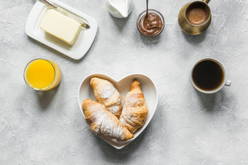 French breakfast with black coffee and croissant. Top view. Flat lay.