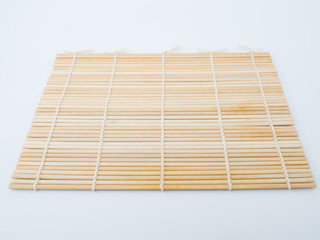chopsticks on bamboo mat