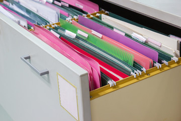 Files document of hanging file folders in a drawer in a whole pile