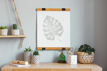 Modern scandinavian room interior with wooden desk, mock up poster frame, elegant accessories,...
