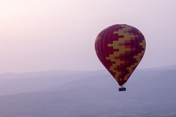 Hot air balloons over mountain landscape in Cappadocia Basket, levitation on October