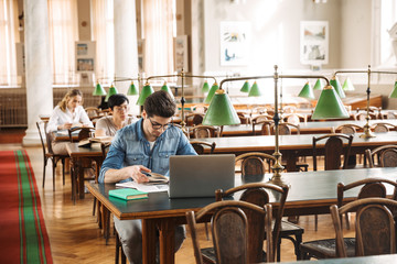 Group of smart young students studying hard