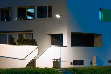 apartment quarter at night with modern LED street lights