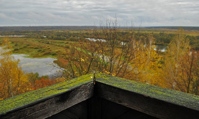 Fototapeta premium An old wooden fortress with high walls and a water ditch