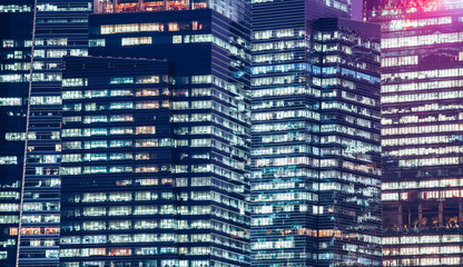 background of skyscrapers windows at night