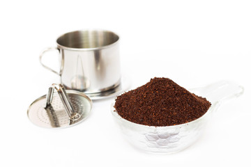 'Phin' traditional Vietnamese coffee maker, place on the top of glass, add ground coffee then pour hot water and wait until the coffee dripping into the glass with condensed milk at the bottom