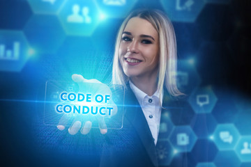 The concept of business, technology, the Internet and the network. A young entrepreneur working on a virtual screen of the future and sees the inscription: Code of conduct