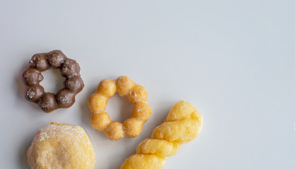 closeup donut on white table with soft-focus in the background. over light 01