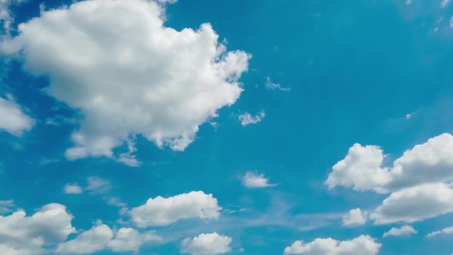 Fast moving clouds on blue sky time lapse